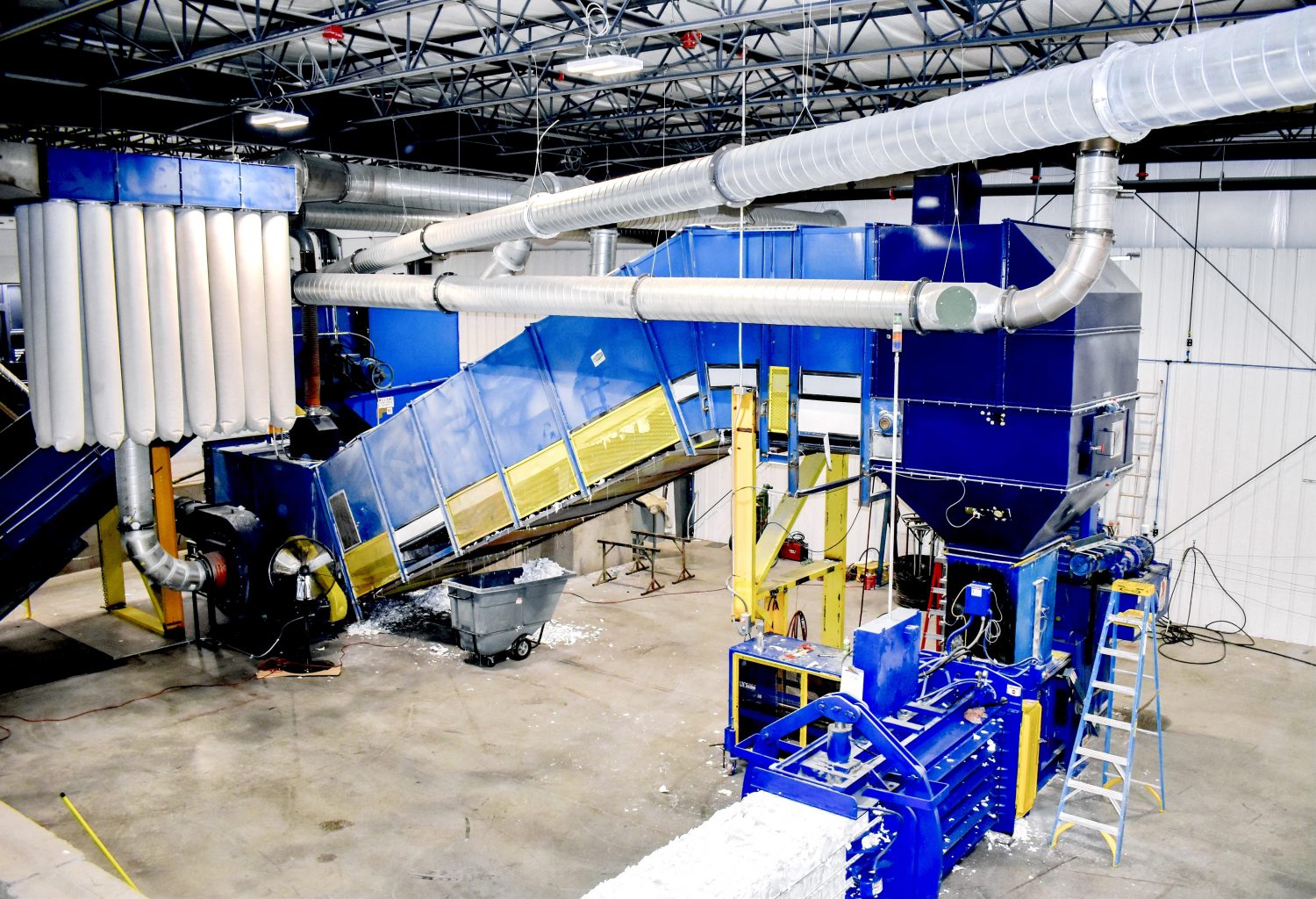 a paper baler machine in a factory